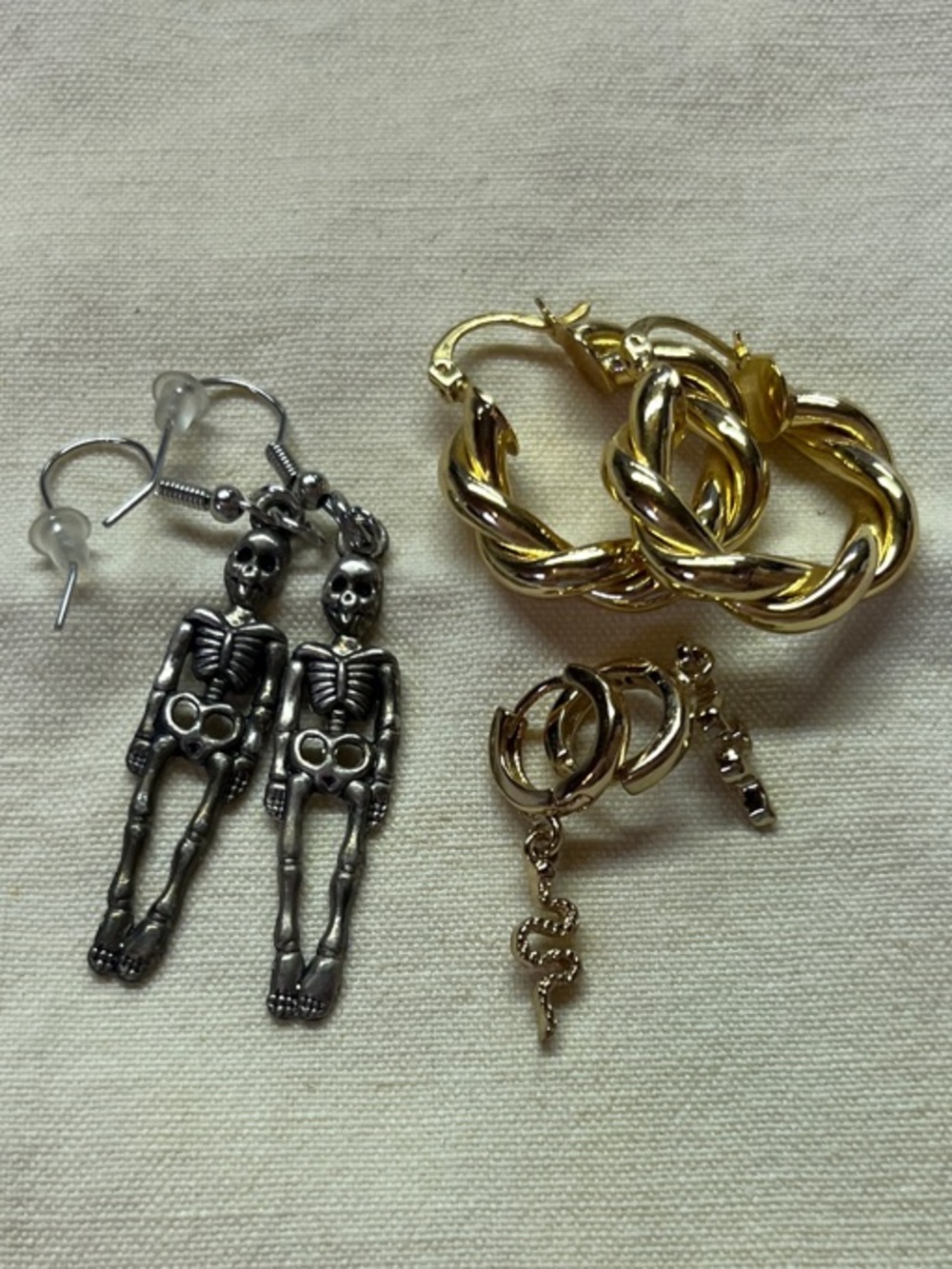 Earring bundle - Gold Twist Hoops, Gold Dangling Snakes, & Silver Skeleton Drops